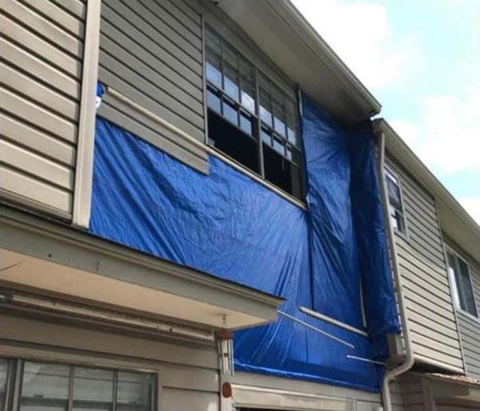tarp to cover damage on apartment